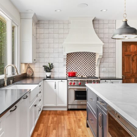 Island with Bay Window Adjacent to Farmhouse Sink