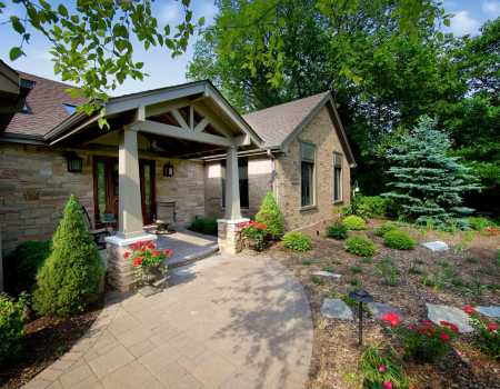 Exterior Portico Addition with Beams and Natural Stone