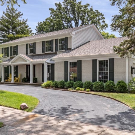 Black Shutters on Light Brick