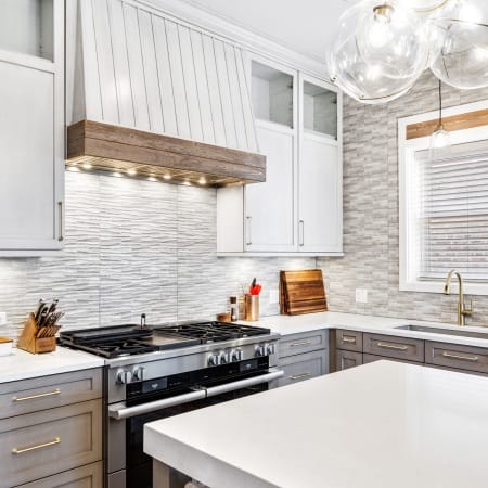 Custom Hood with Natural Stone Backsplash