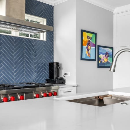 White Counter and Blue Backsplash