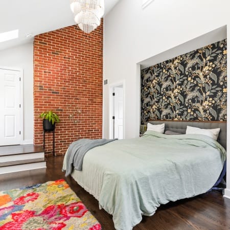 Bedroom with Custom Cut-Out and Exposed Brick
