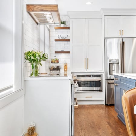 White and Blue Shaker Cabinets with Copper Touches