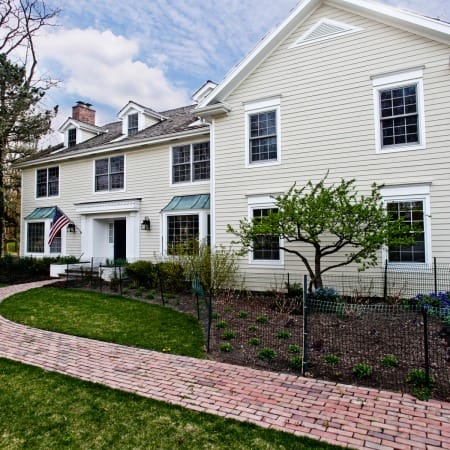 Front of Home with Copper Awnings