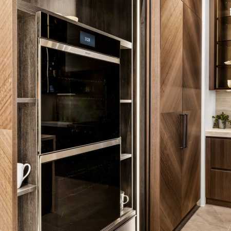Pocket doors for hidden ovens