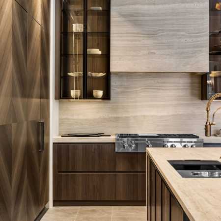 Full-height stone backsplash with matching fume hood and countertops
