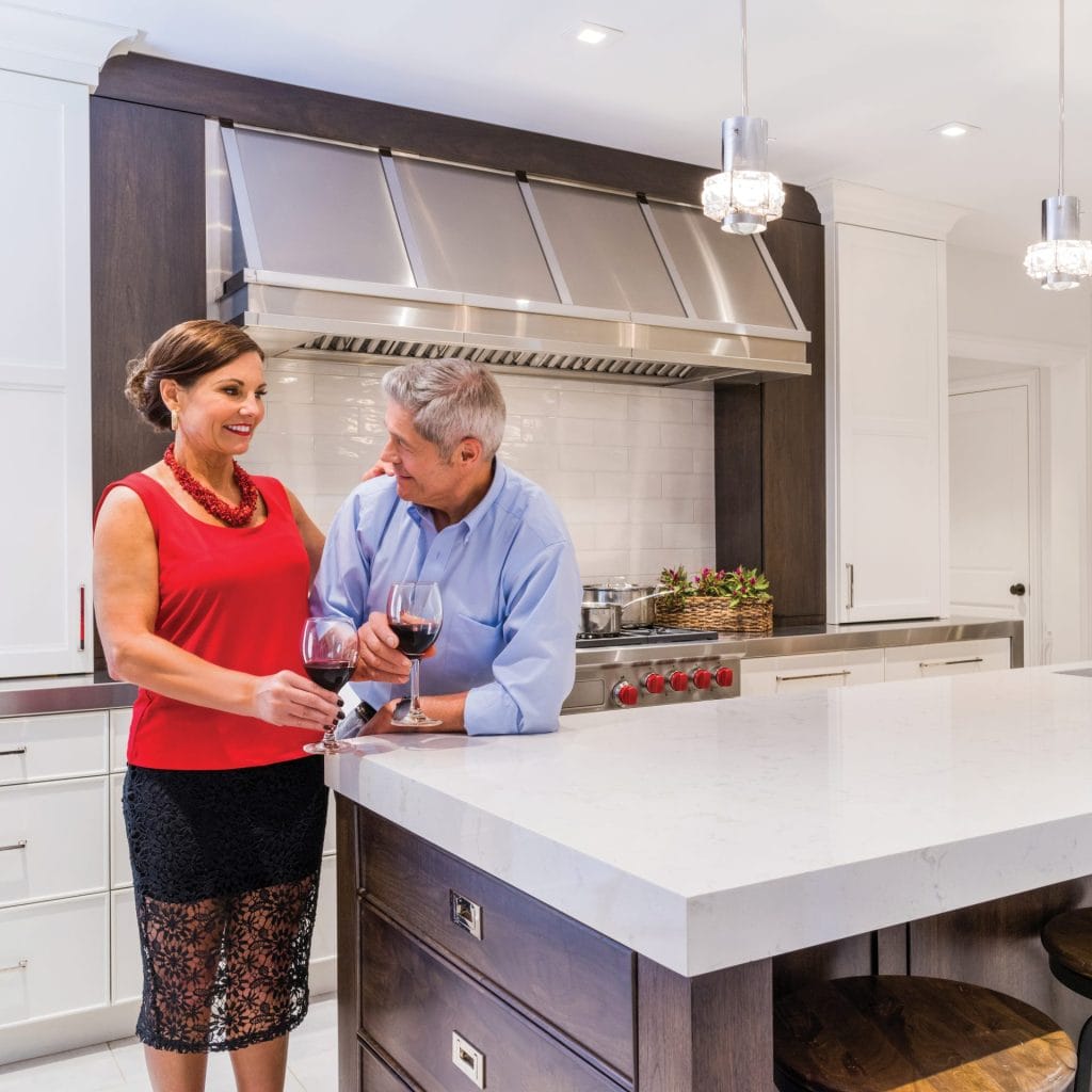 A couple enjoying their newly remodeled kitchen by Airoom
