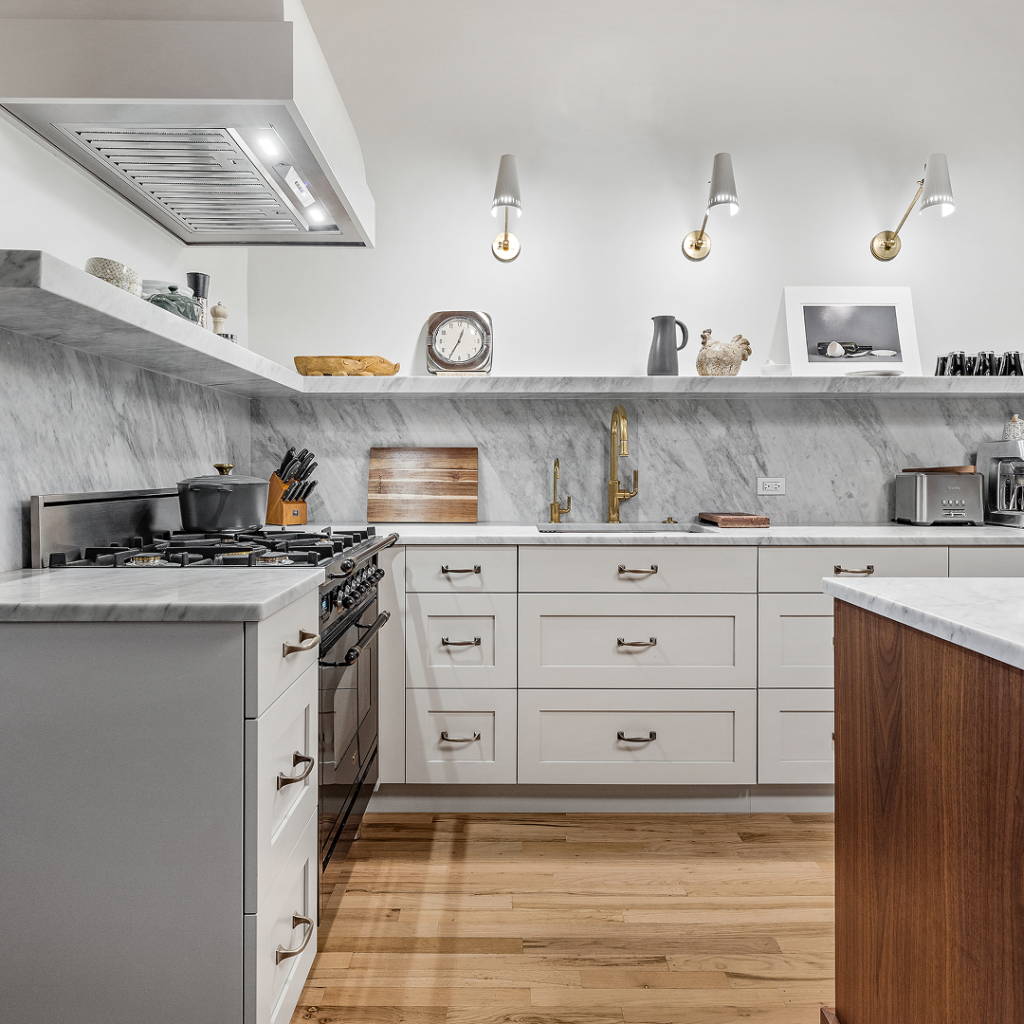 bright kitchen remodel with quartz backsplash, white cabinets, and brown wood island